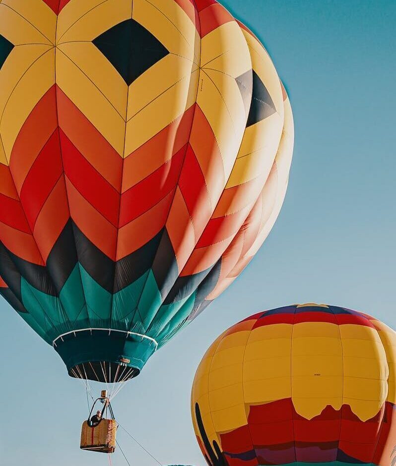 Vibrant hot air balloons soaring in the sky, offering a stunning view.